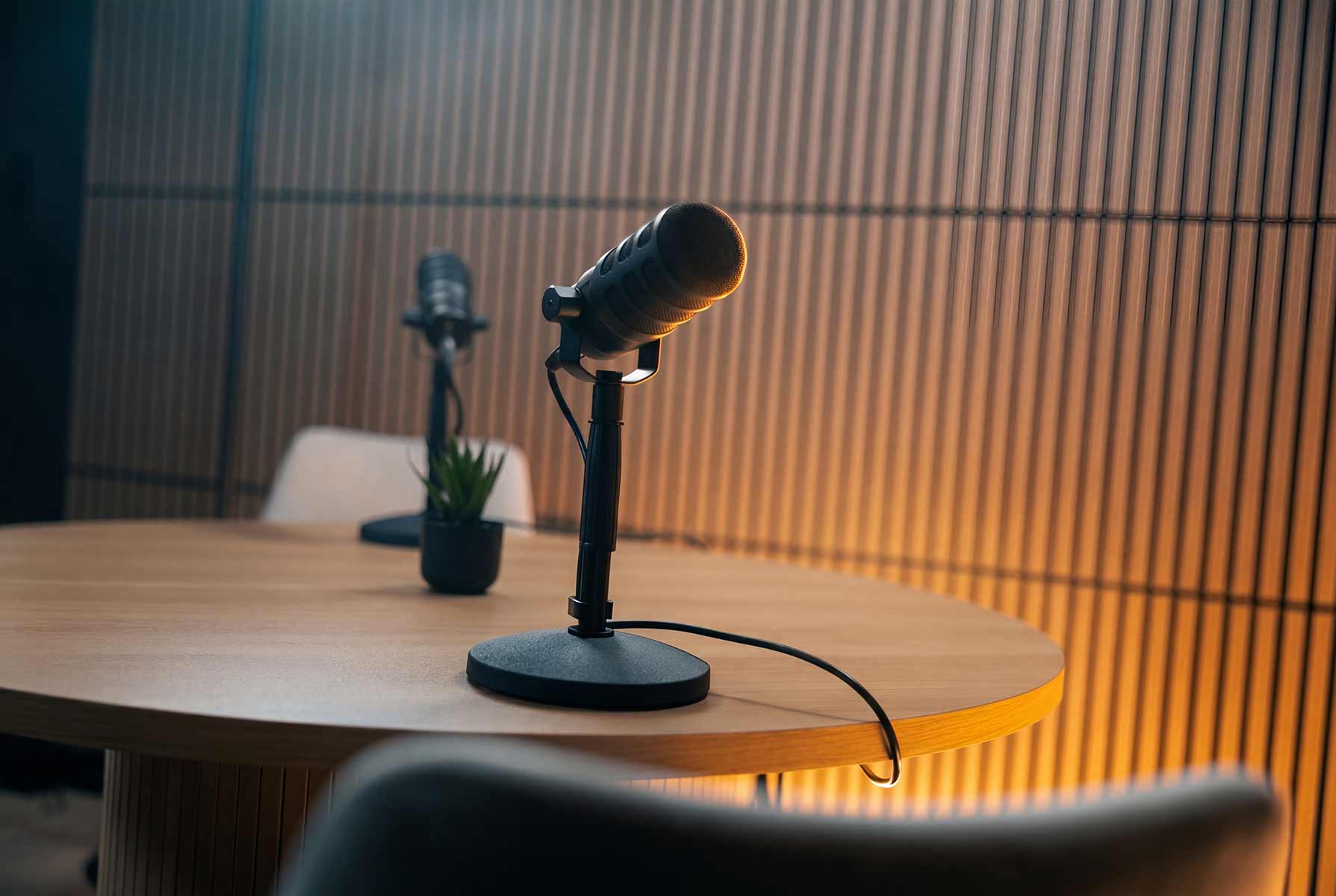 Close-up of a podcast microphone on the Content Studio's round table