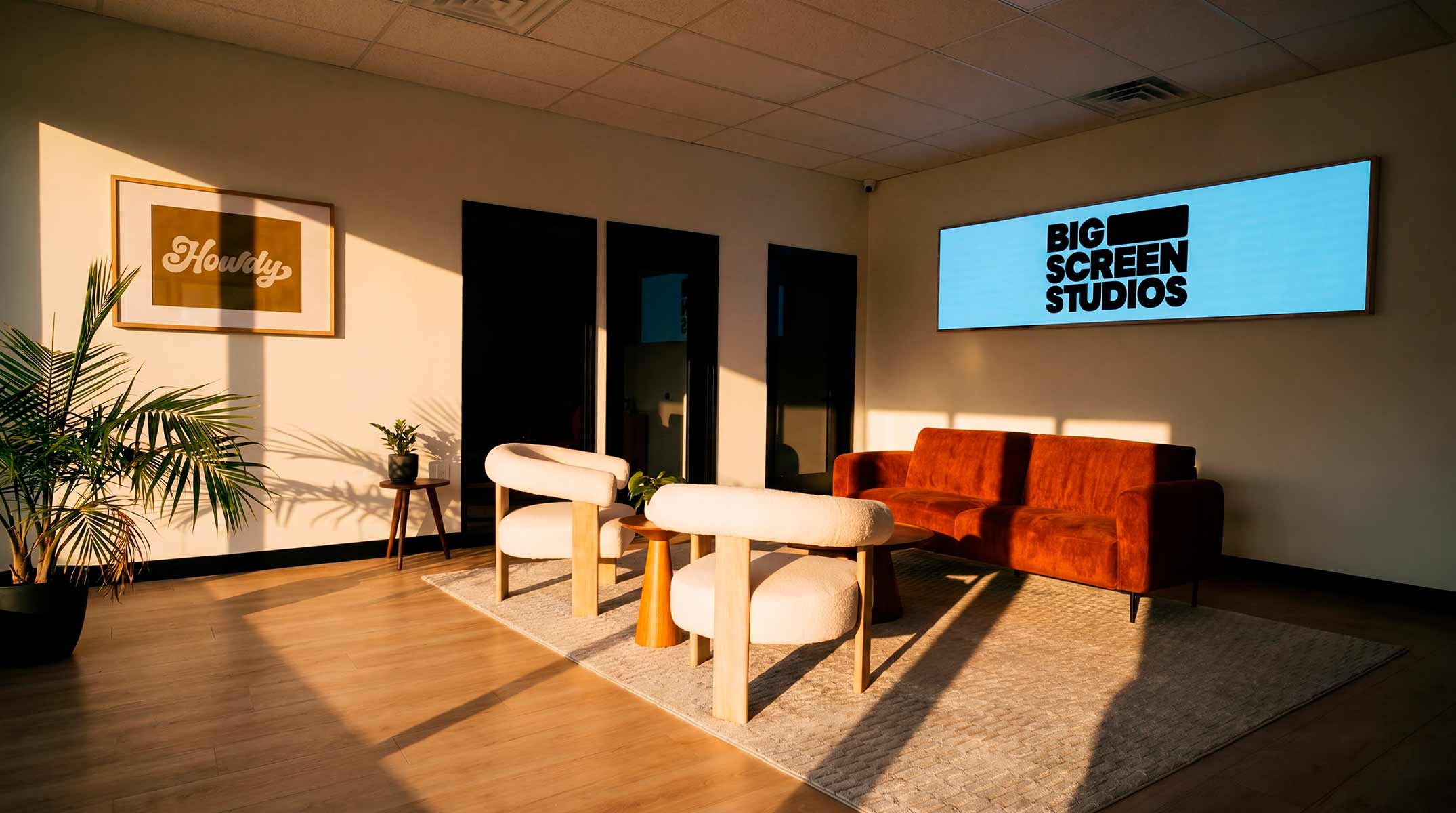 Big Screen Studios lobby with custom signage and lounge seating
