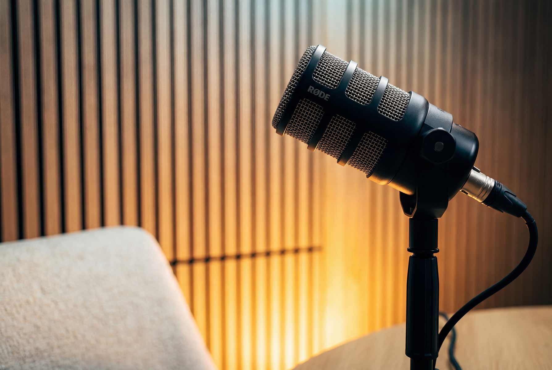 Close-up of a RØDE microphone on a stand in the Content Studio